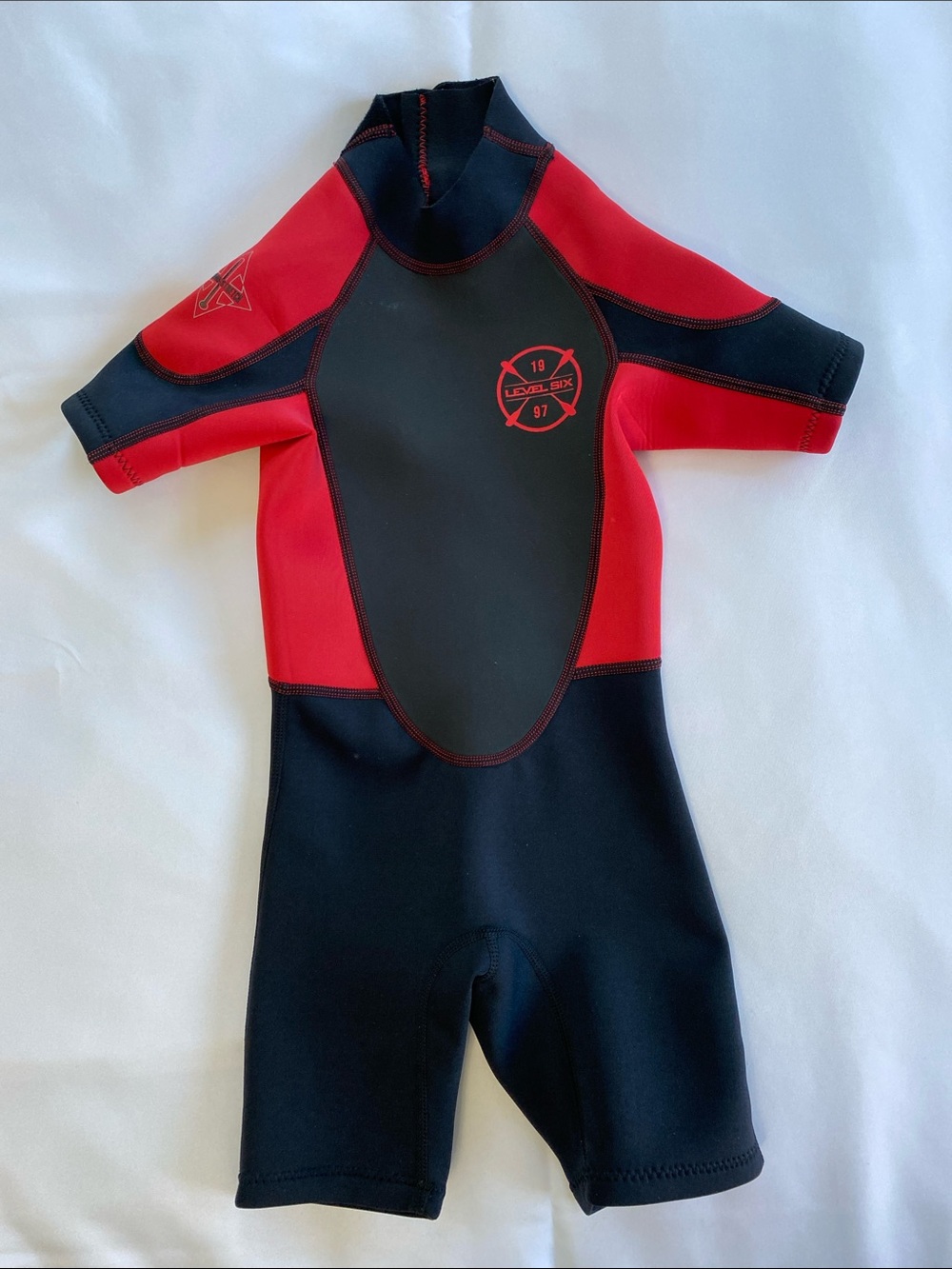 Kids Level Six Red & Black Shorty Wetsuit. Size 4T.